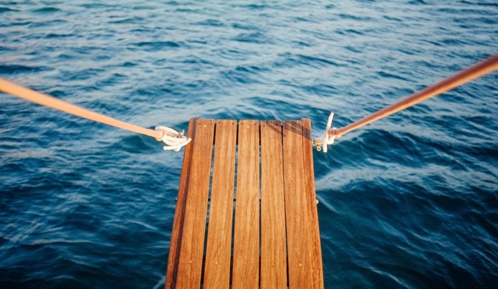 Wooden plank on a boat over the water