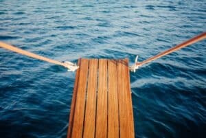Wooden plank on a boat over the water