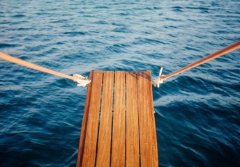 Wooden plank on a boat over the water