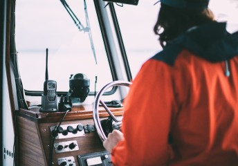 Captain driving a boat