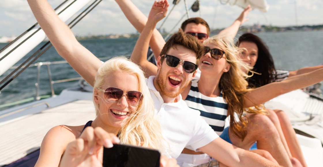 Young people on a boat having fun