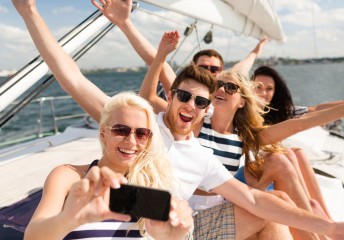 Young people on a boat having fun