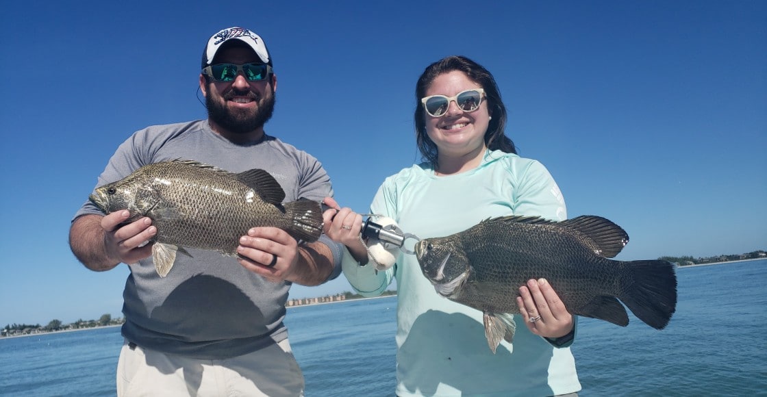 Father and daughter with tripletail in Florida - Catch Memories Boatsetter Fishing Giveaway