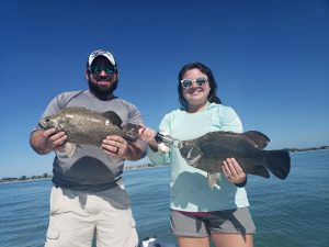 Father and daughter with tripletail in Florida - Catch Memories Boatsetter Fishing Giveaway