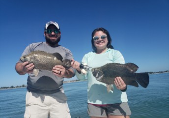 Father and daughter with tripletail in Florida - Catch Memories Boatsetter Fishing Giveaway