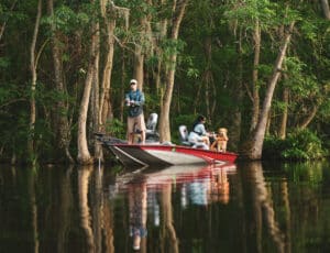 Fisher casting from aluminum fishing boat