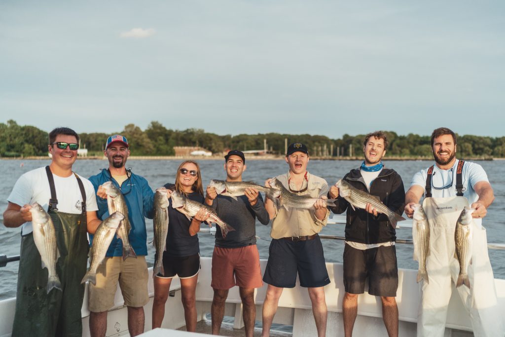 Anglers with striped bass on a fishing charter from Annapolis, Maryland