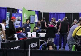 Booths and attendees at the Fly Fishing Show in Denver