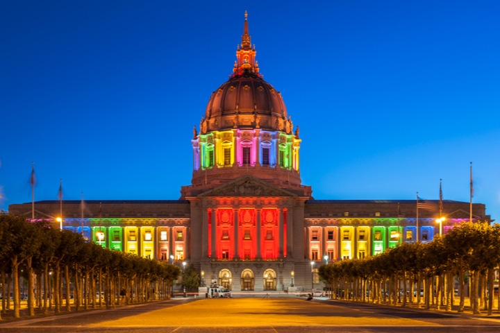 San Francisco City Hall illuminated in rainbow colors for Pride Week.