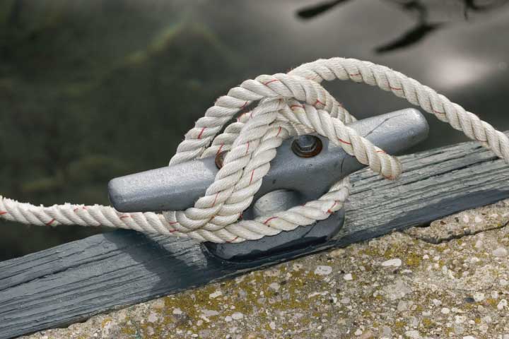 Tying a boat to a cleat.