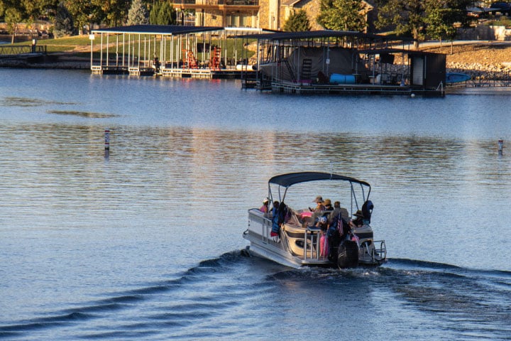 Driving a Pontoon Boat.