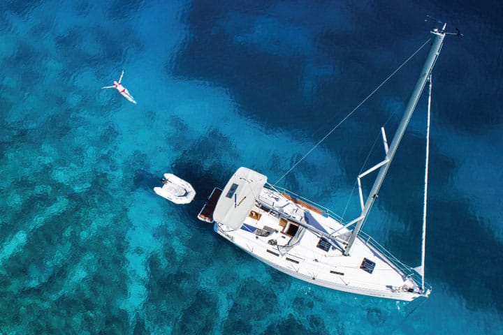 Swimming off a yacht.