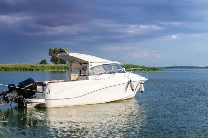 Boat with storm clouds / bad weather in the distance.