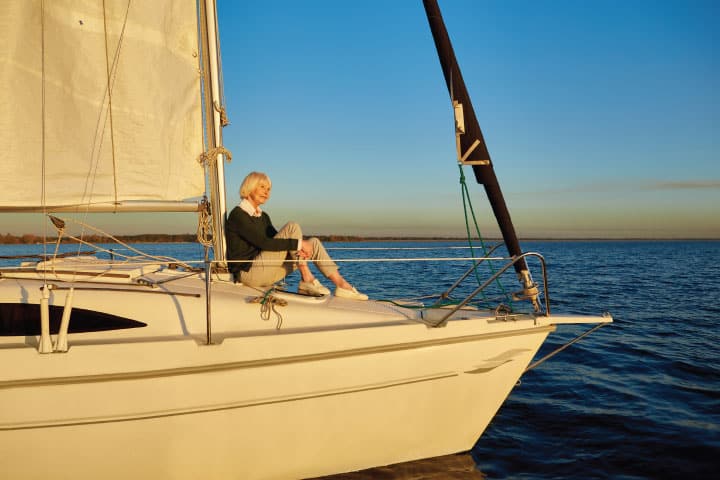 Retired woman on a sailboat.