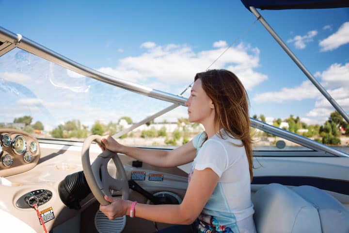 Woman docking a boat.