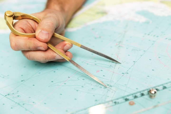 Measuring distance on a nautical chart.
