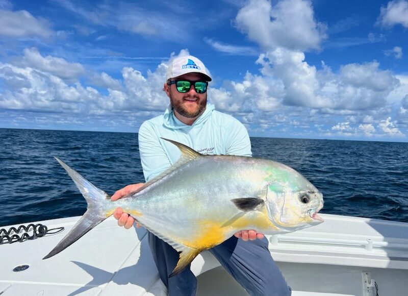Capt. Matt Luttman holds a pompano caught inshore near St. Petersburg, Florida
