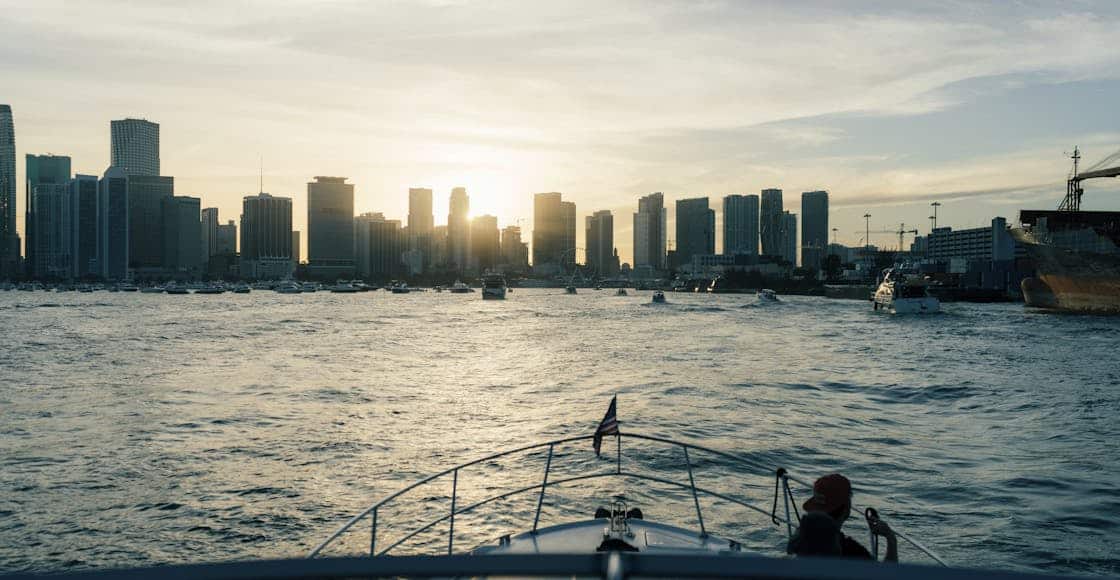 Enjoy a serene boat ride with Miami's iconic skyline at sunset, offering a perfect urban escape.