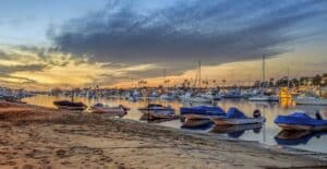 boats on beach during sunset