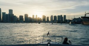 Enjoy a serene boat ride with Miami's iconic skyline at sunset, offering a perfect urban escape.