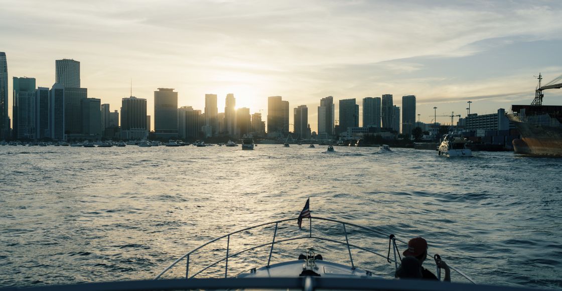 Enjoy a serene boat ride with Miami's iconic skyline at sunset, offering a perfect urban escape.