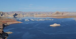 A breathtaking aerial view of Lake Powell's crystal waters and scenic rock formations, ideal for travel enthusiasts and nature lovers.
