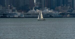 Sailboat on the Hudson River with the New York City skyline as a backdrop.